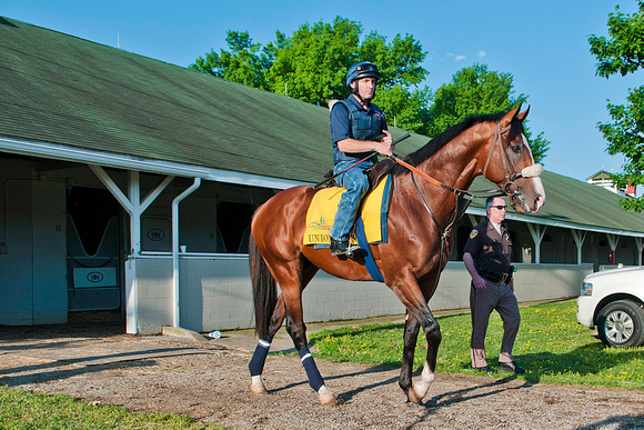 Union Rags with exercise rider Peter Brette, heads out to the track for a jog in preparation for Kentucky Derby 138.