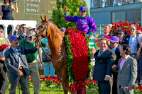California Chrome and rider Victor Espinoza in the winner's circle after winning the 140th Kentucky Derby.