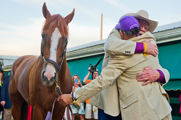 Part owner Steve Coburn hugs exercise rider Willie Delgad after winning the 139th Preakness Stakes at Pimlico Race Course in Baltimore, Maryland.