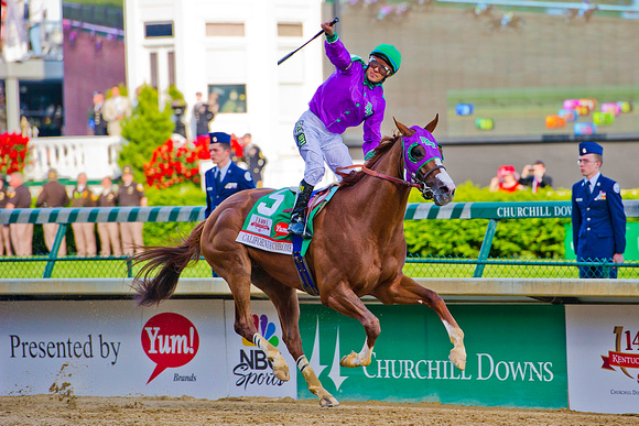California Chrome, Victor Espinoza up, wins the 140th Kentucky Derby at Churchill Downs in Louisville, Kentucky.